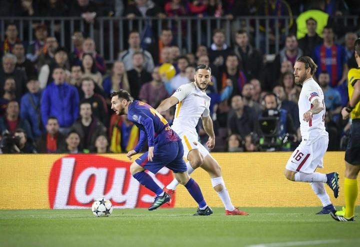 Messi_Manolas_Barcellona_Roma_lapresse_2018