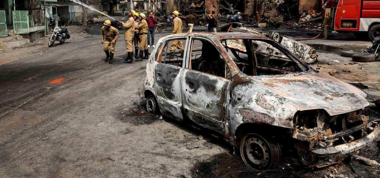 Fire fighters douse a fire at Gokul puri tyre market which was burnt Tuesday in New Delhi, India, Wednesday, Feb. 26, 2020. At least 20 people were killed in three days of clashes in New Delhi, with the death toll expected to rise as hospitals were overflowed with dozens of injured people, authorities said Wednesday. The clashes between Hindu mobs and Muslims protesting a contentious new citizenship law that fast-tracks naturalization for foreign-born religious minorities of all major faiths in South Asia except Islam escalated Tuesday. (AP Photo/Manish Swarup)